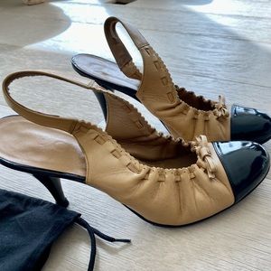 Patent black leather and cream Chanel sling back 3 inch heel
